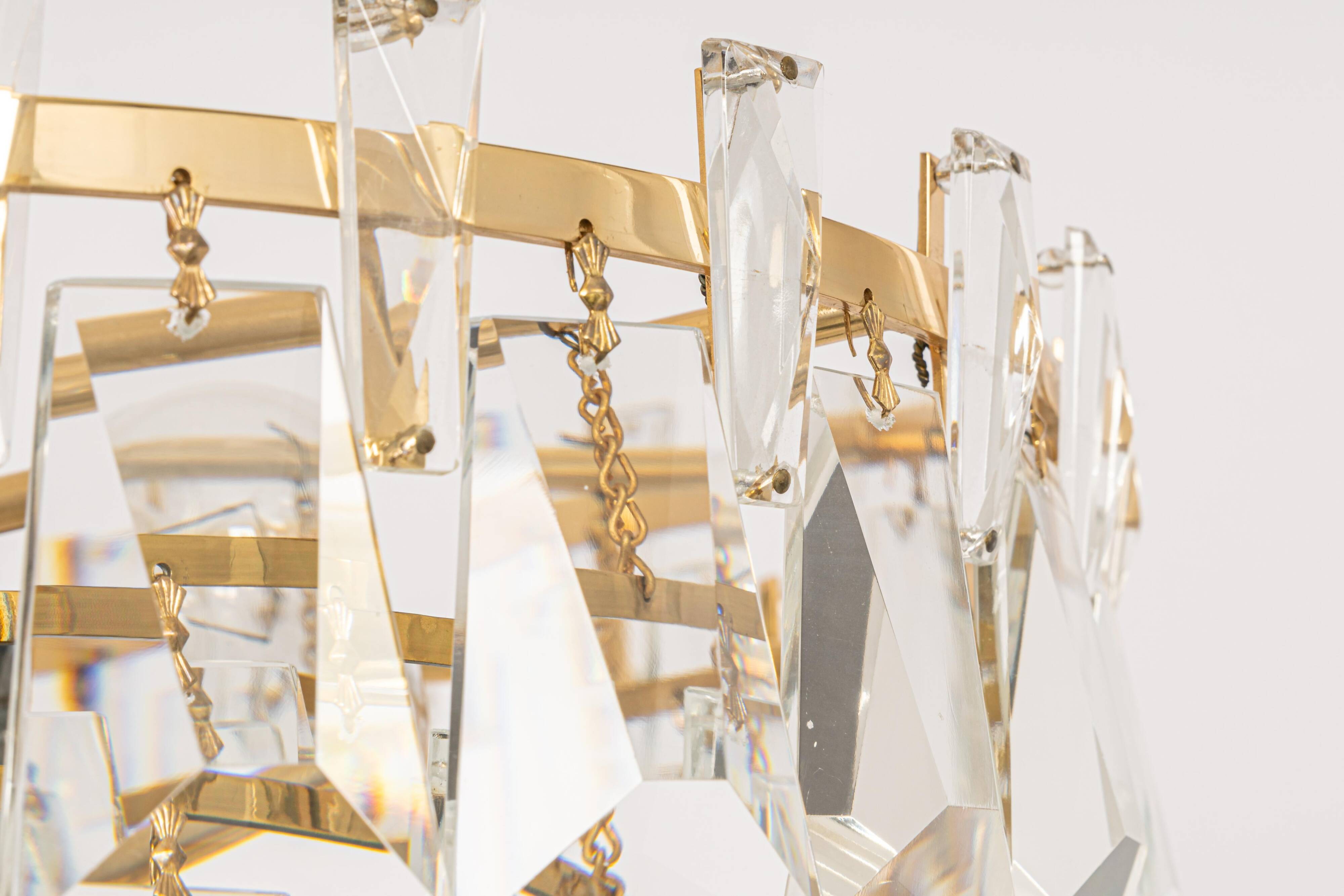 Large chandelier in gilded brass and crystal, by Palwa, Germany, 1970s.