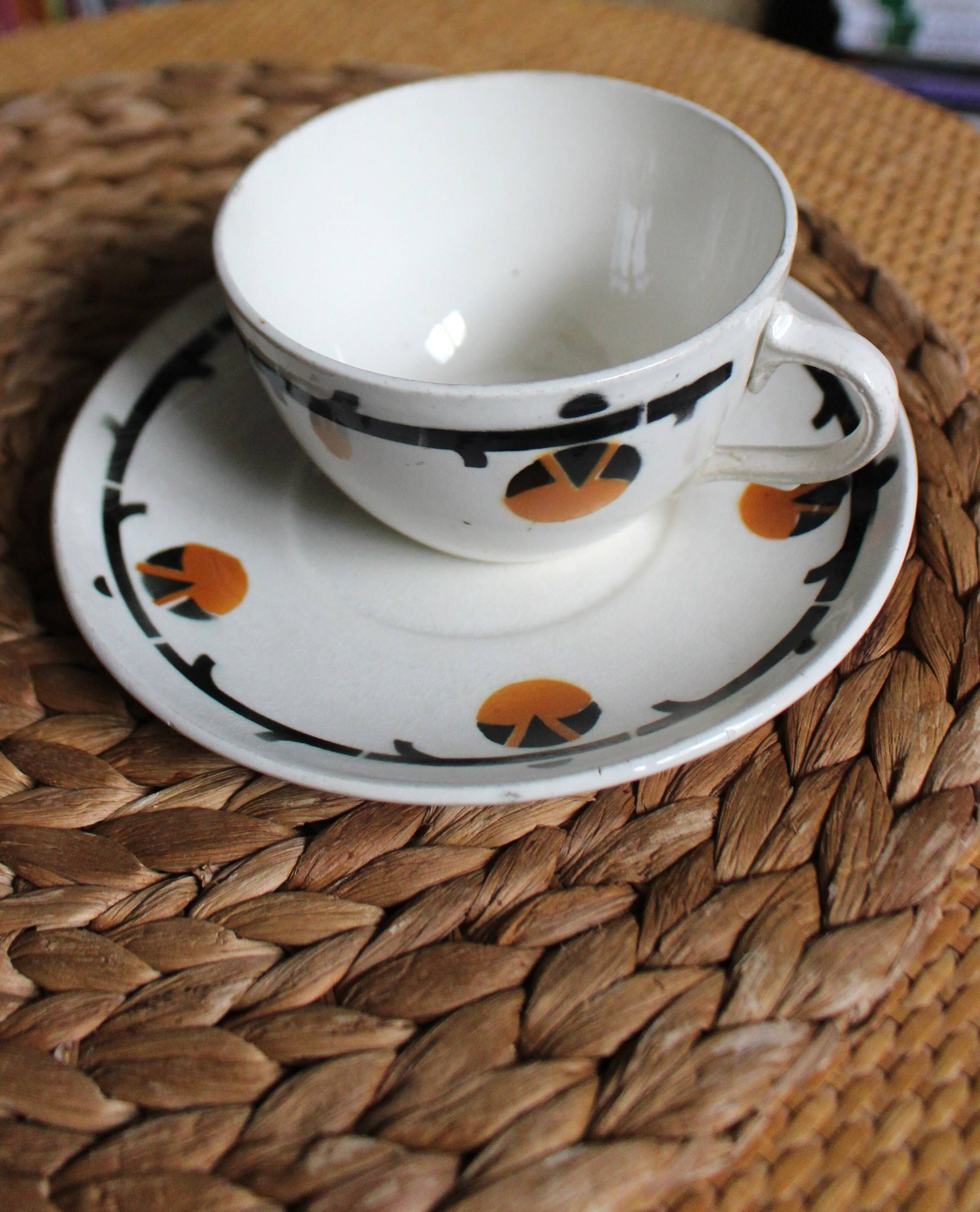 A large cup of chocolate tea, saucer Badonviller Barcarolle orange black.