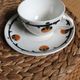 A large cup of chocolate tea, saucer Badonviller Barcarolle orange black.