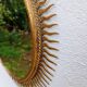 Miroir soleil vintage doré en métal – style années 60/70