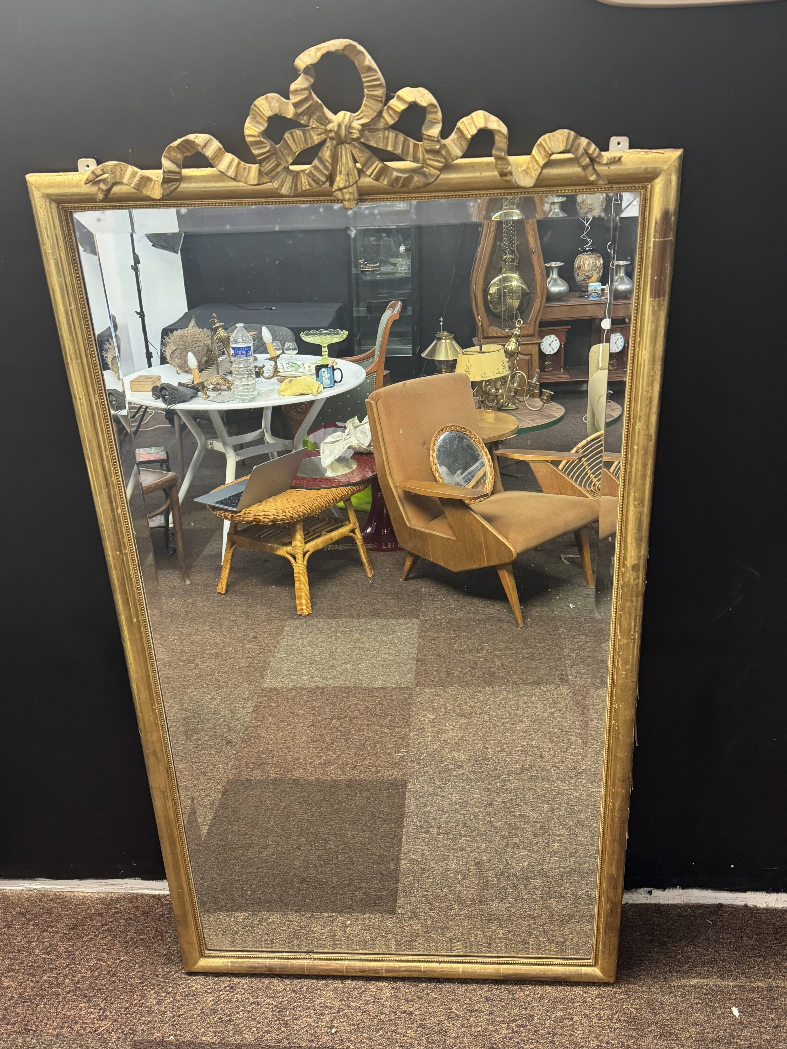 Large mirror with a gold frame