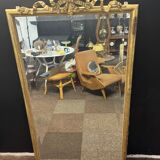 Large mirror with a gold frame