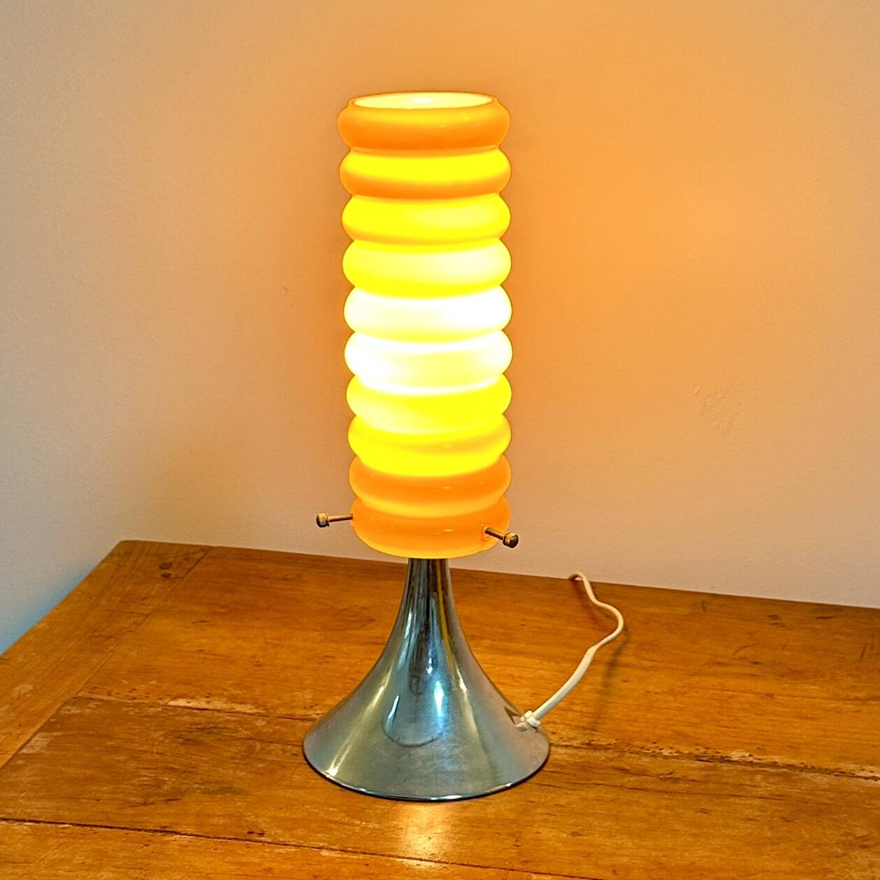 Vintage orange lamp with chrome tulip base and glass shade