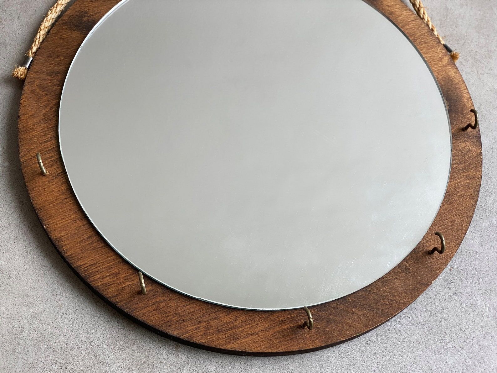 Vintage round wooden wall mirror with hooks