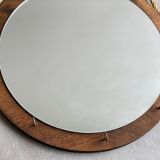 Vintage round wooden wall mirror with hooks