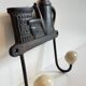 Coat rack made of steel and porcelain