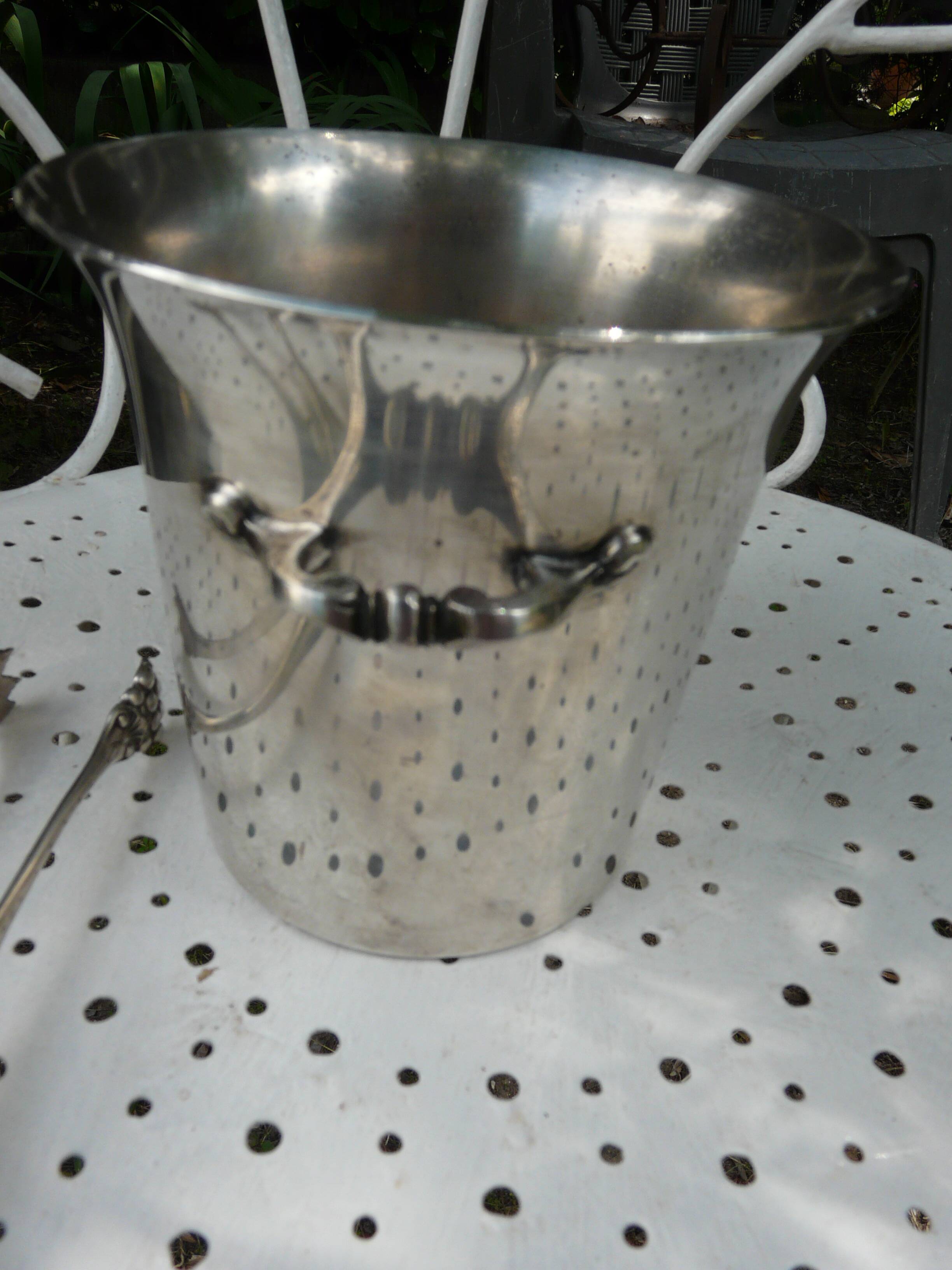 Silver metal ice bucket with its lion's pate tongs