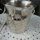 Silver metal ice bucket with its lion's pate tongs