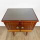 1950s bedside table in varnished wood veneer and brass.