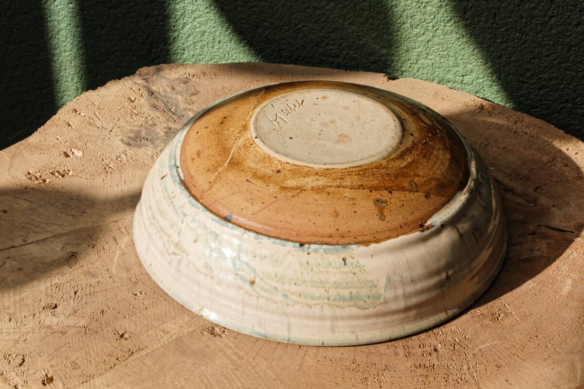 Hollow stoneware dish, signed Yves Loiselet