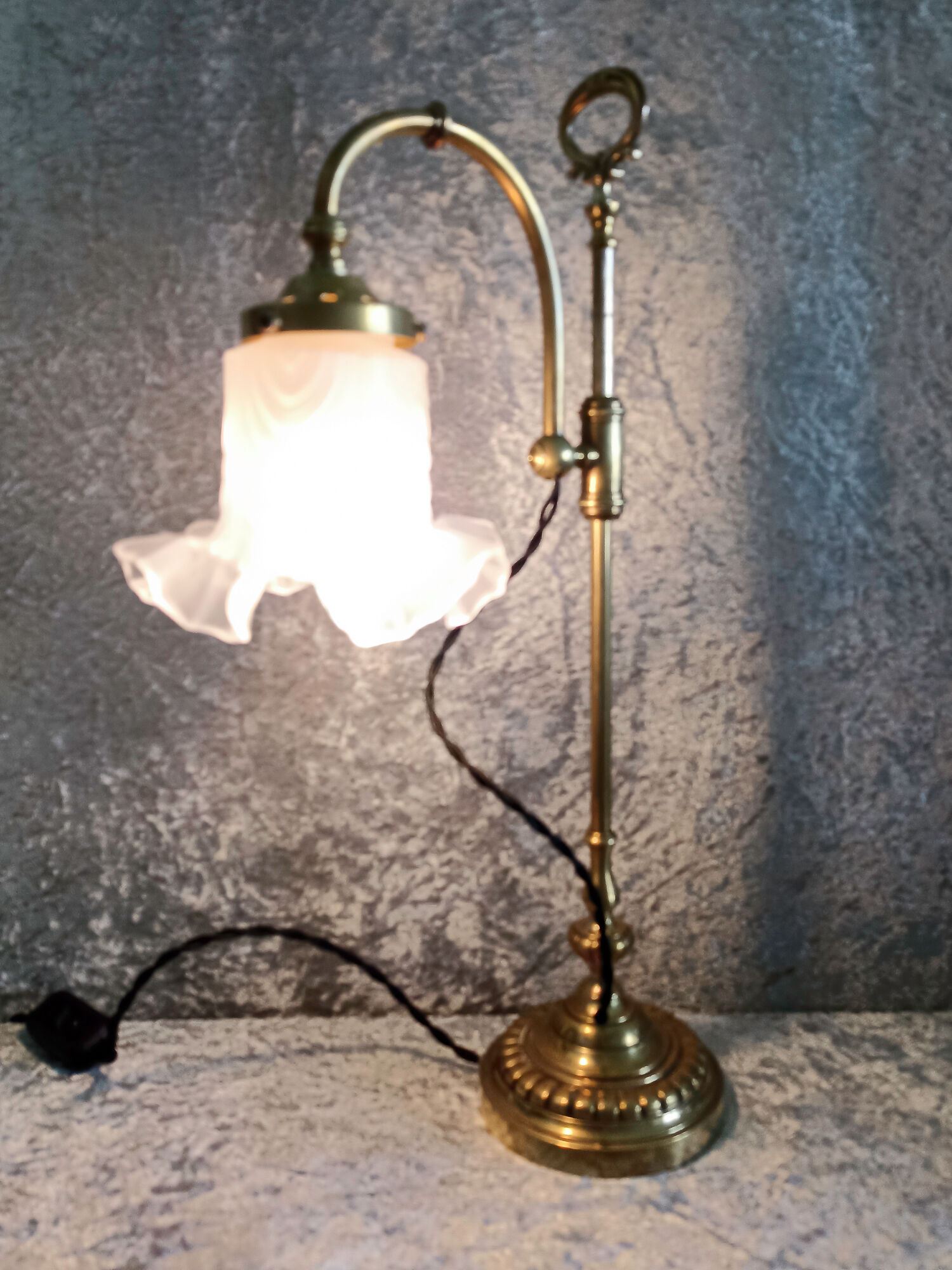 Adjustable brass desk lamp with frosted glass tulip