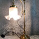 Adjustable brass desk lamp with frosted glass tulip