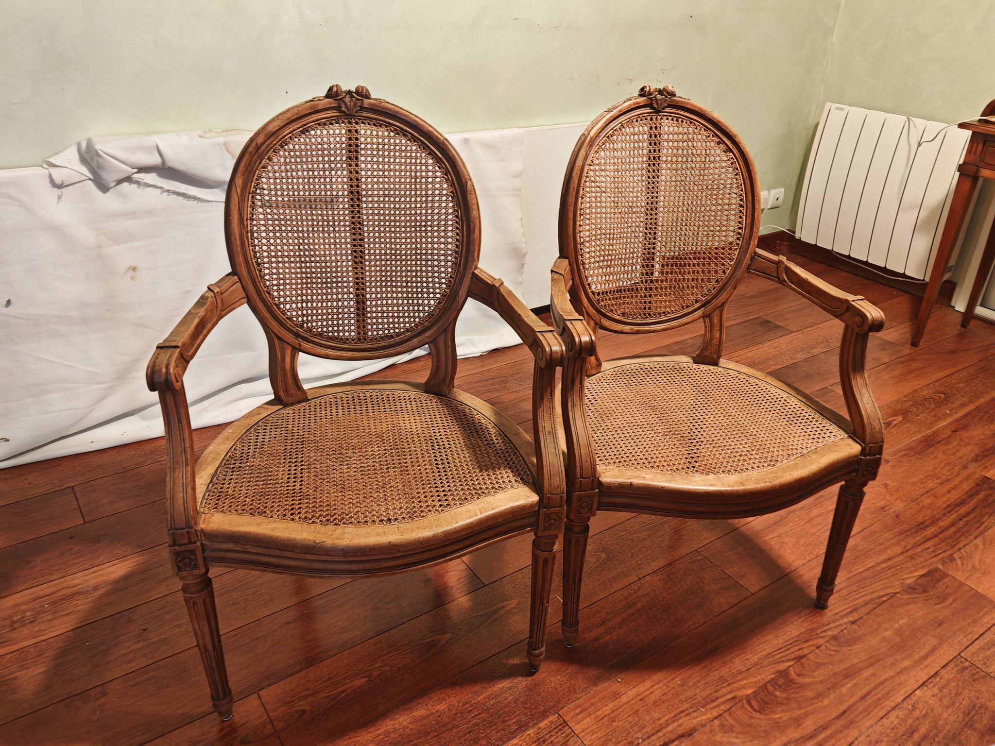 Caned armchairs