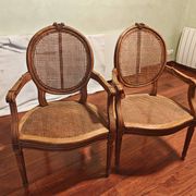 Caned armchairs