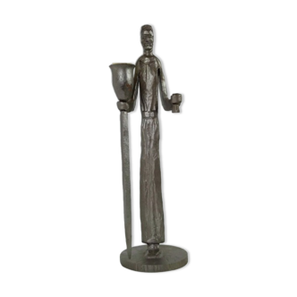 Vintage wrought iron candle holder by Gisbert depicting a man holding a candle and a mug