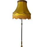 Vintage gold floor lamp with fringed shade.