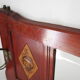 Red wooden wall-mounted coat rack and Art Deco mirror