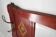 Red wooden wall-mounted coat rack and Art Deco mirror