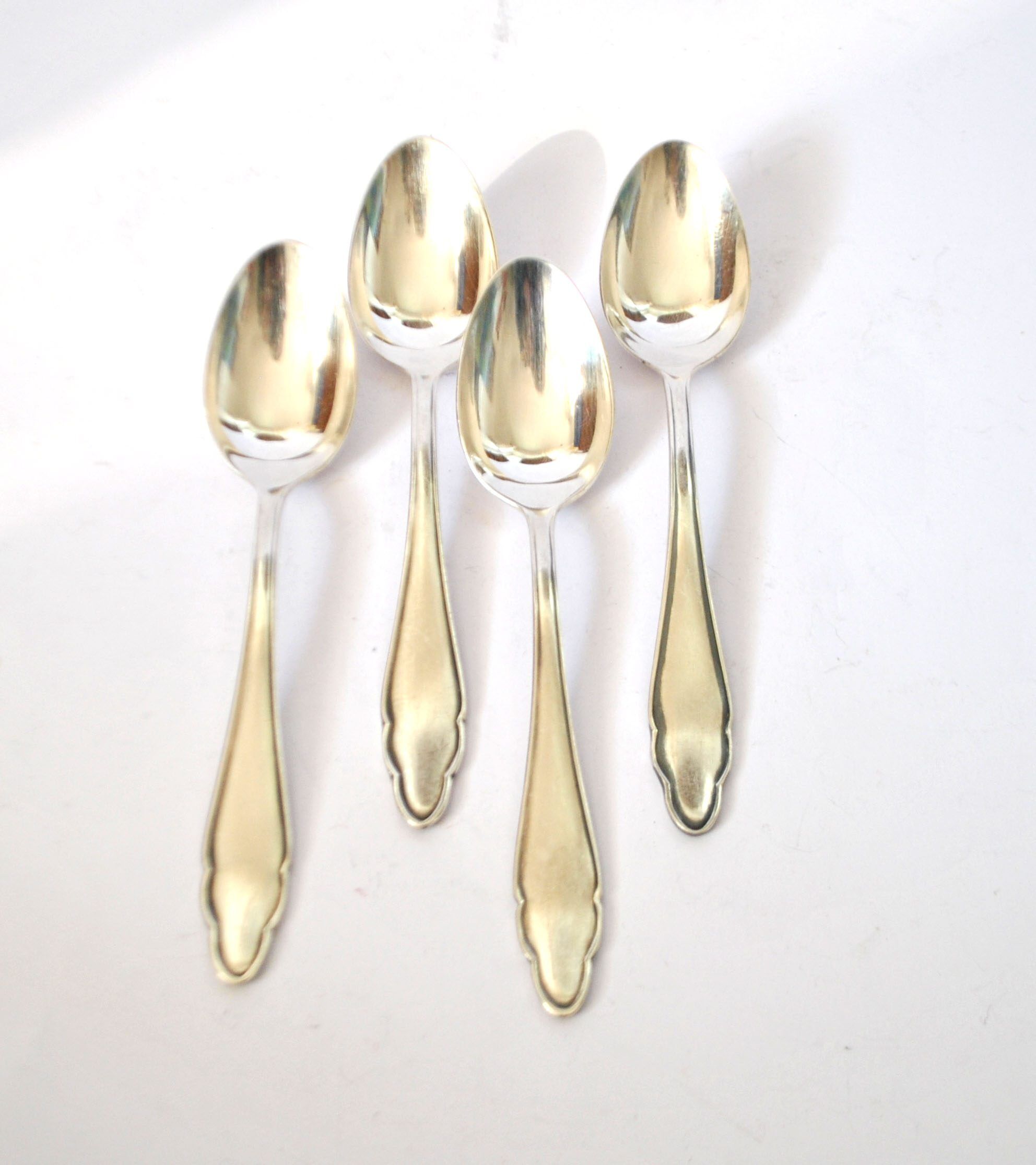 DEETJEN set of 4 silver-plated dessert spoons with a modernist scalloped design.