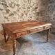 Antique French walnut table with six drawers, parquet top, early 20th century.