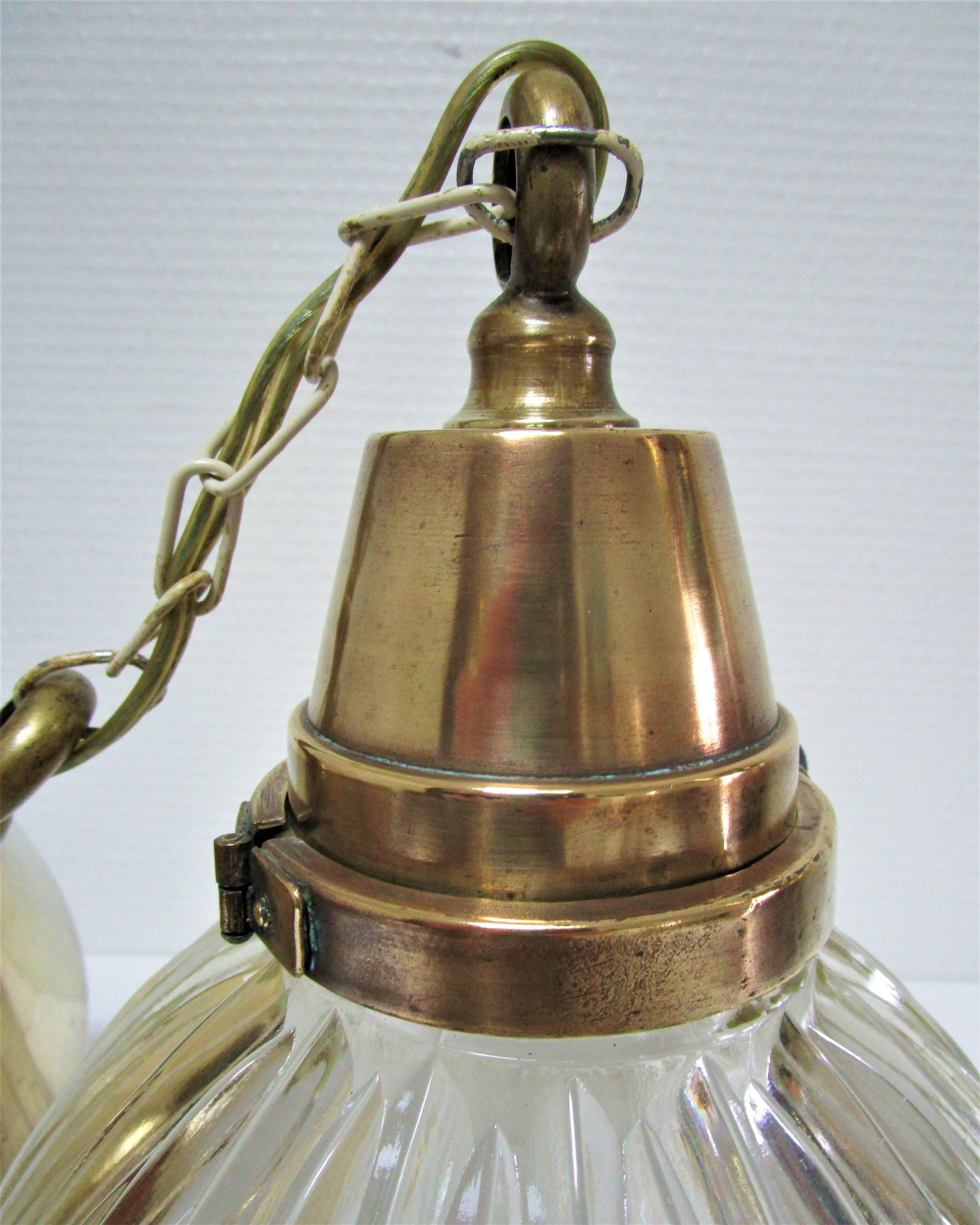 Holophane glass suspension and vintage patinated brass