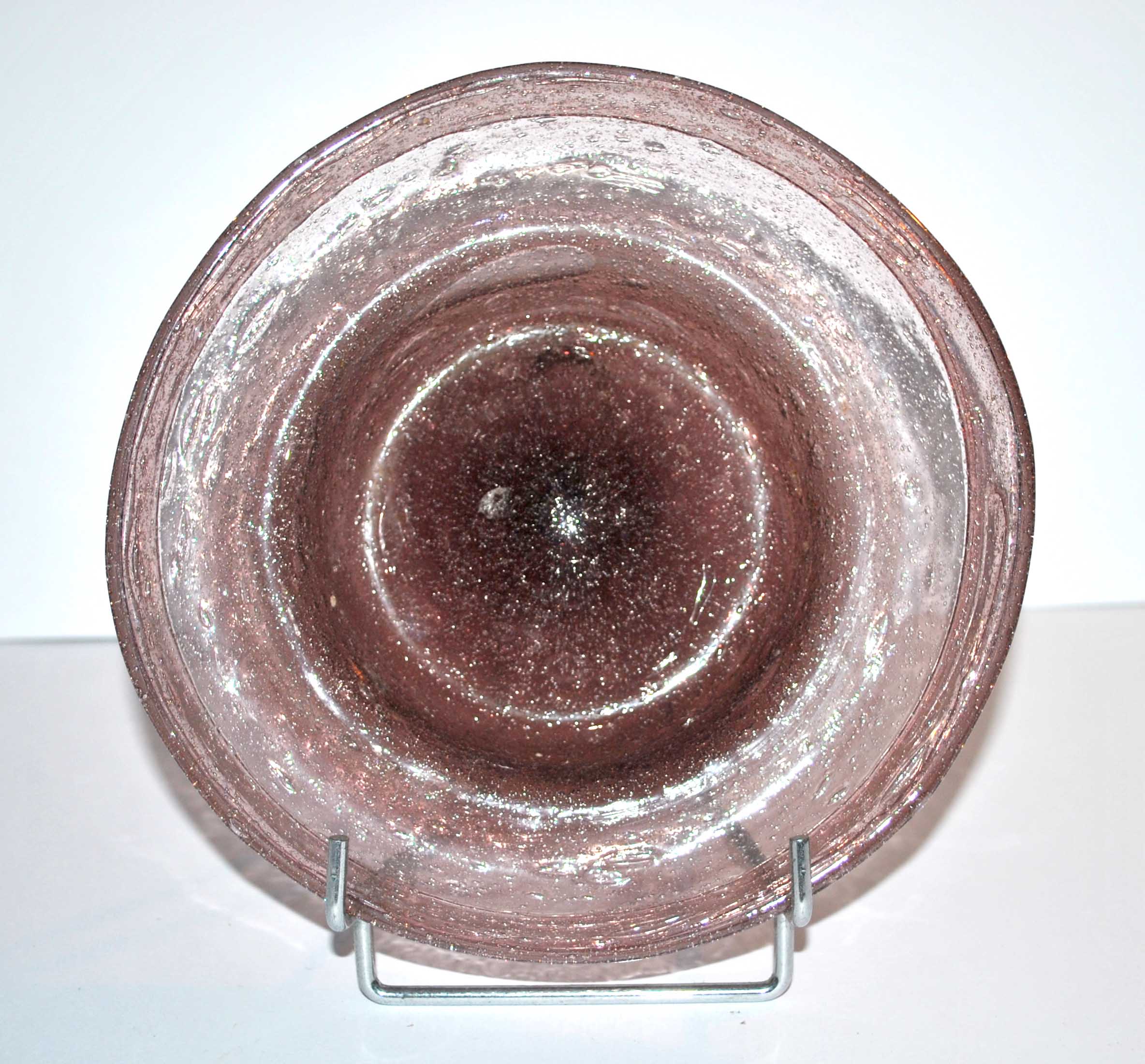 Antique plate in pink bubbled blown glass