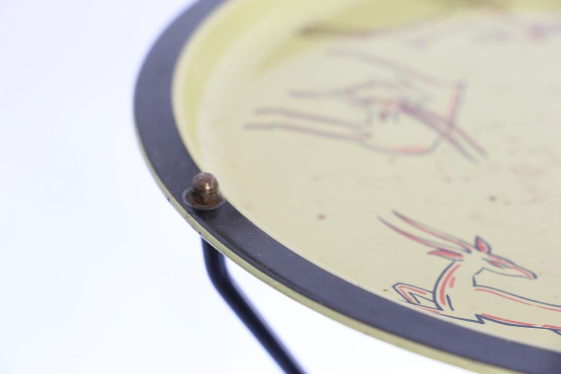 Black and yellow enamelled metal table, vintage, African Antelope motif, 1960