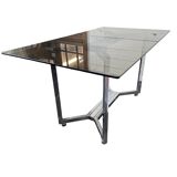Chromed metal table with smoked glass top