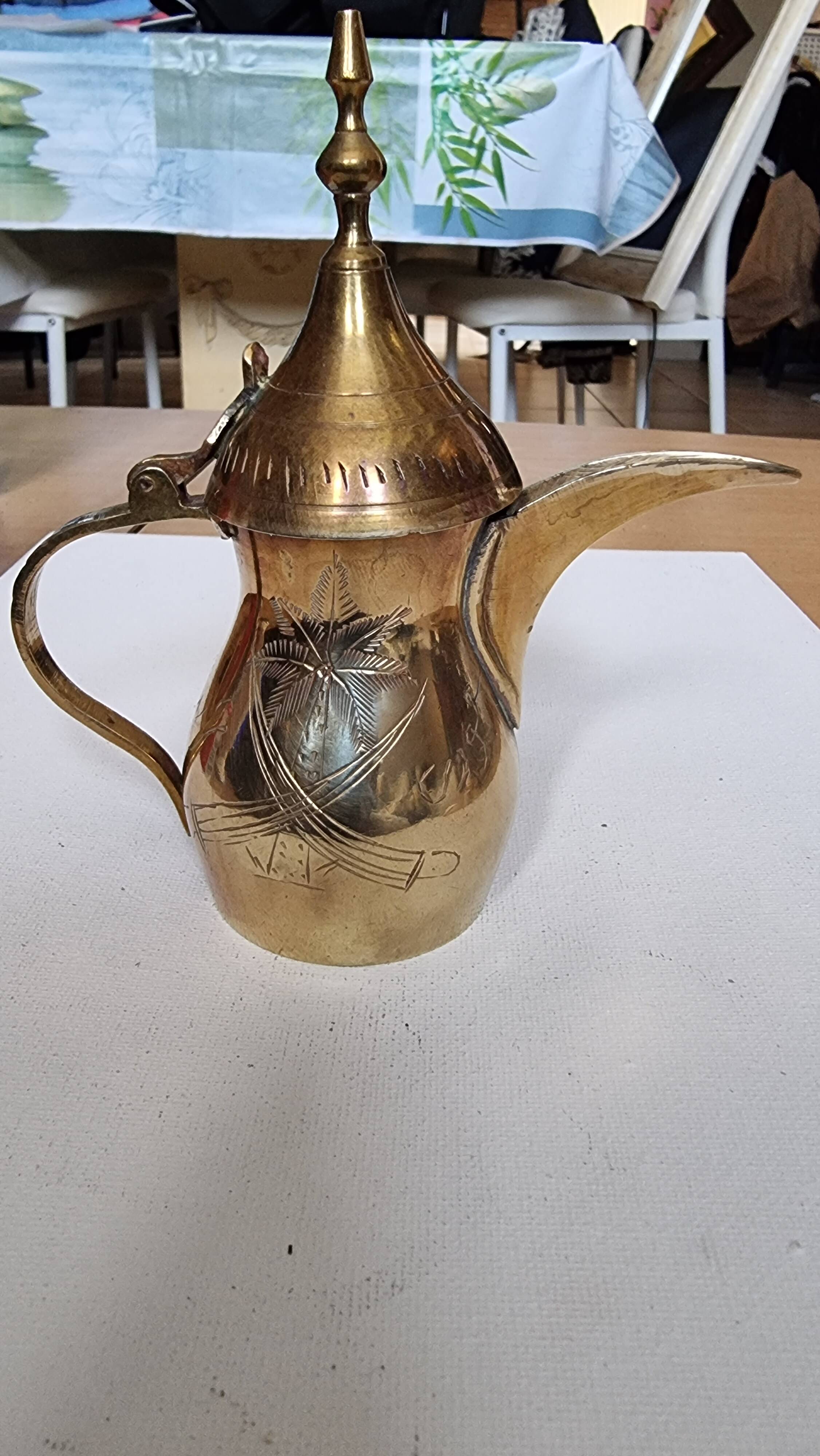 Small carved brass pourer