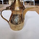Small carved brass pourer