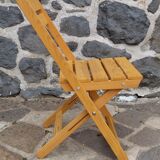 Pair of folding chairs in blond wood