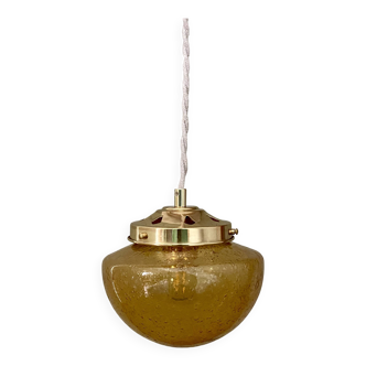 Vintage globe pendant light in bubbled amber glass