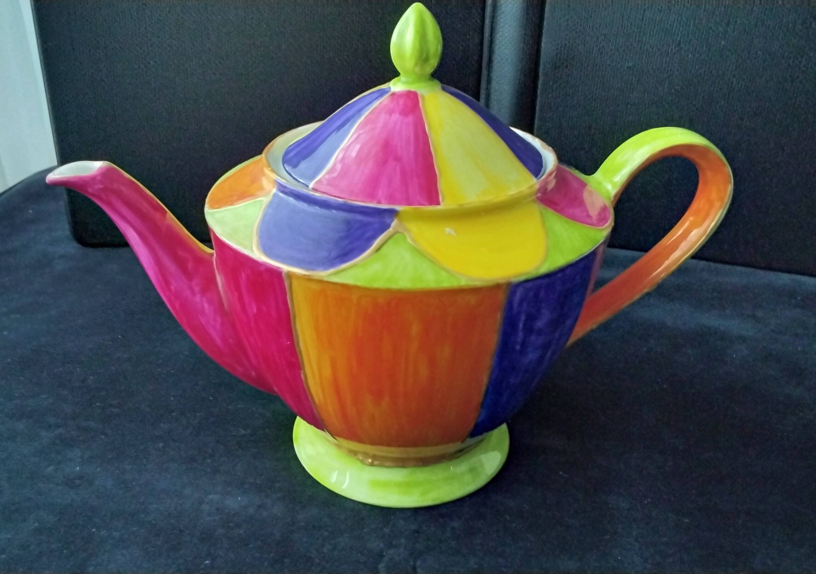 Polychrome porcelain teapot hand-painted.
