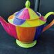 Polychrome porcelain teapot hand-painted.