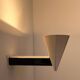 Vintage modernist wall lamp, cream and black lacquered metal, Italy 1970s