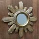 Vintage sun mirror in golden resin 60s/70s