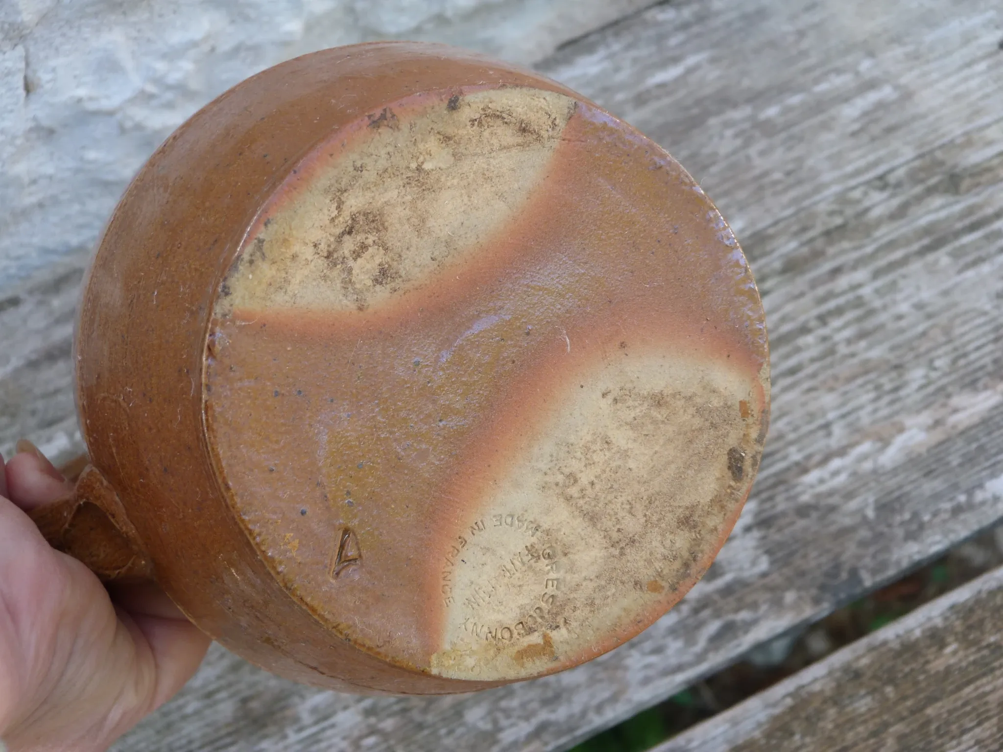 Old stoneware wine jug with patterns