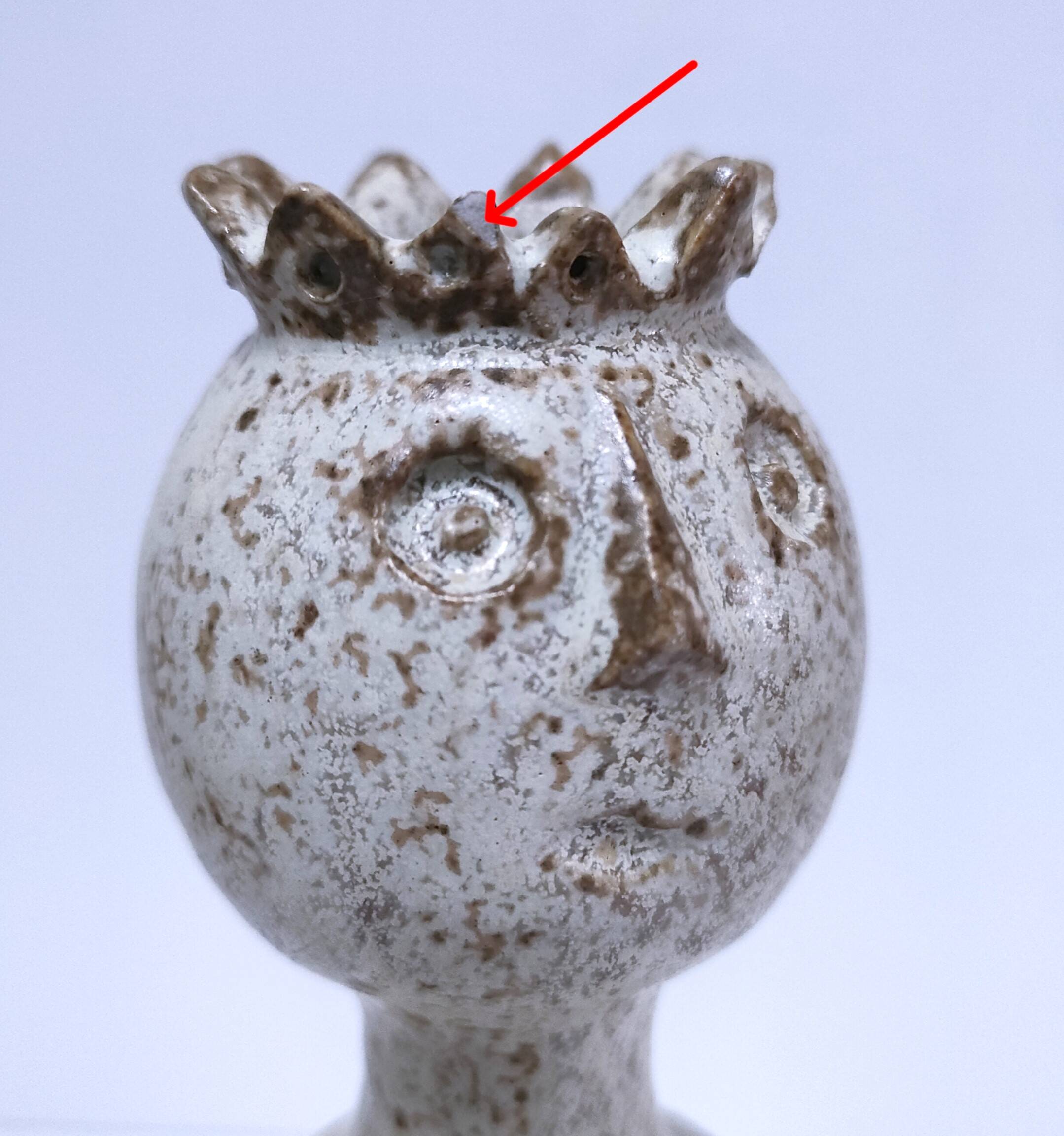 ceramic candle holder with crowned head signed P