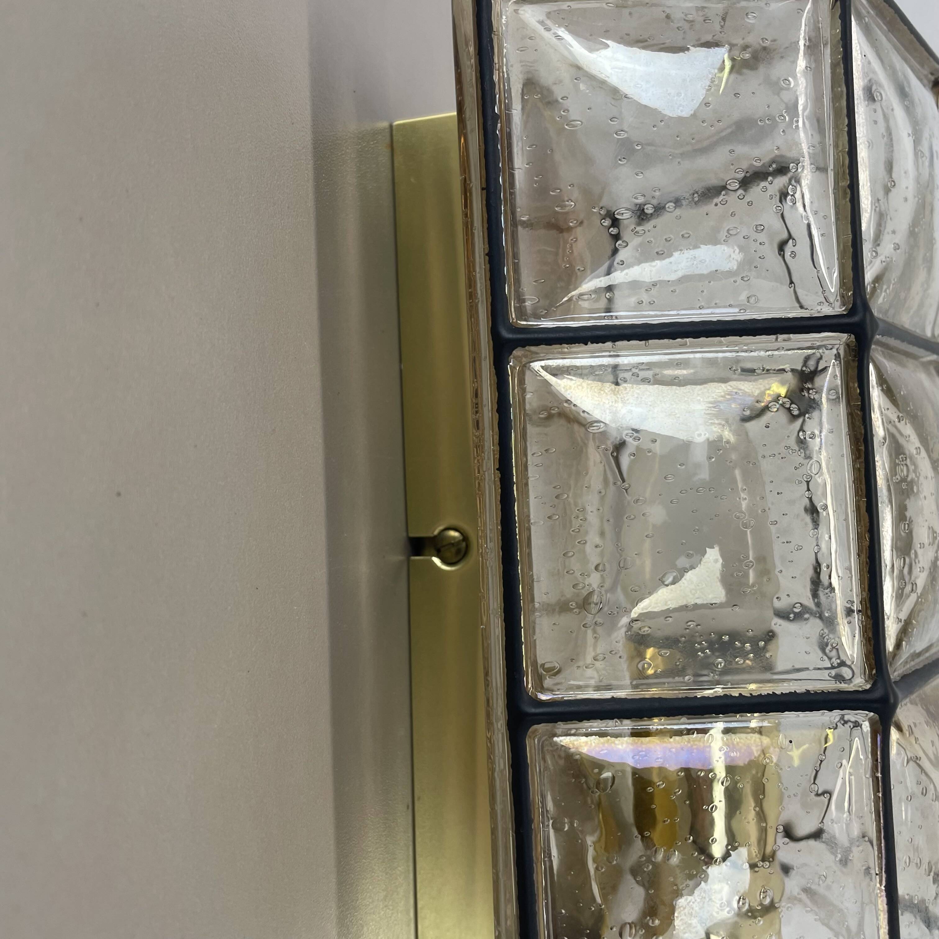 Wall light "Iron Rings" in brass and glass by Glashütte Limburg, Germany, 1970s