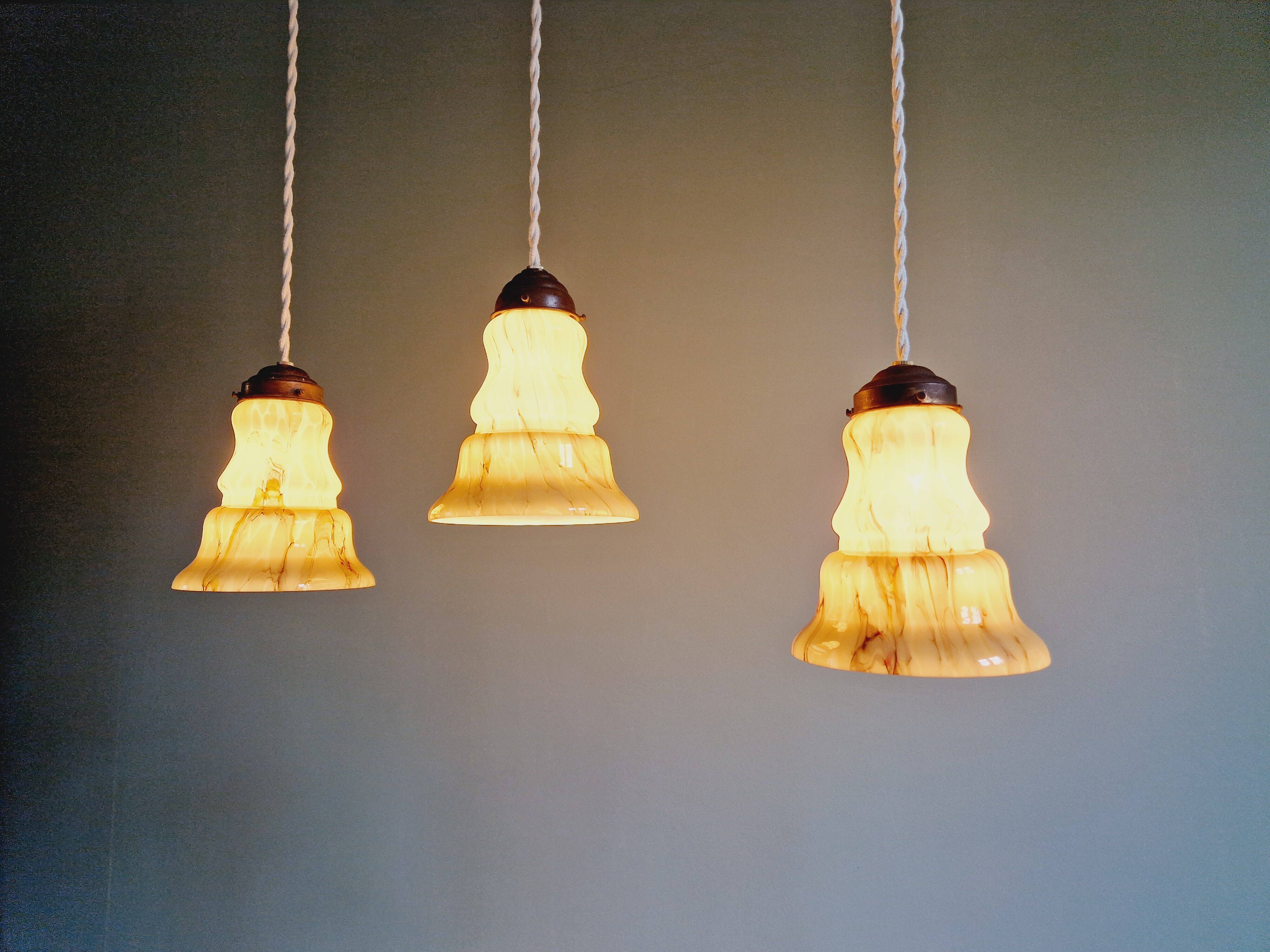 Set of 3 Art Deco marbled opaline pendant lights, 1920s-30s