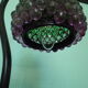 Lampe à poser, pied en fonte et abat jour en perles années 60