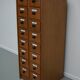 German Oak Apothecary Cabinet with Enamel Shields, 1940s