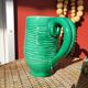 Green glazed ceramic pitcher