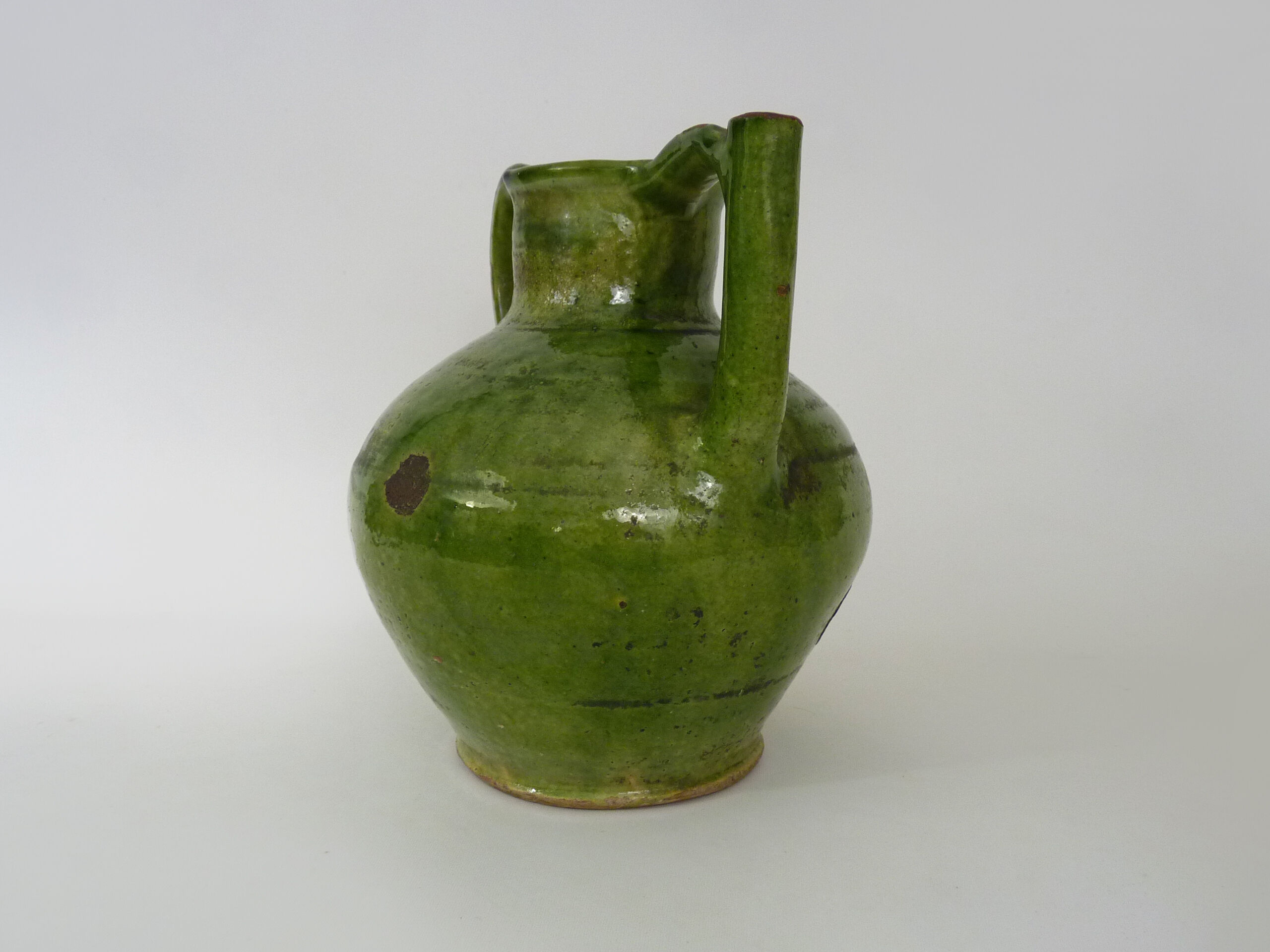 Pitcher pottery in green glazed terracotta, south west of France. XIXth