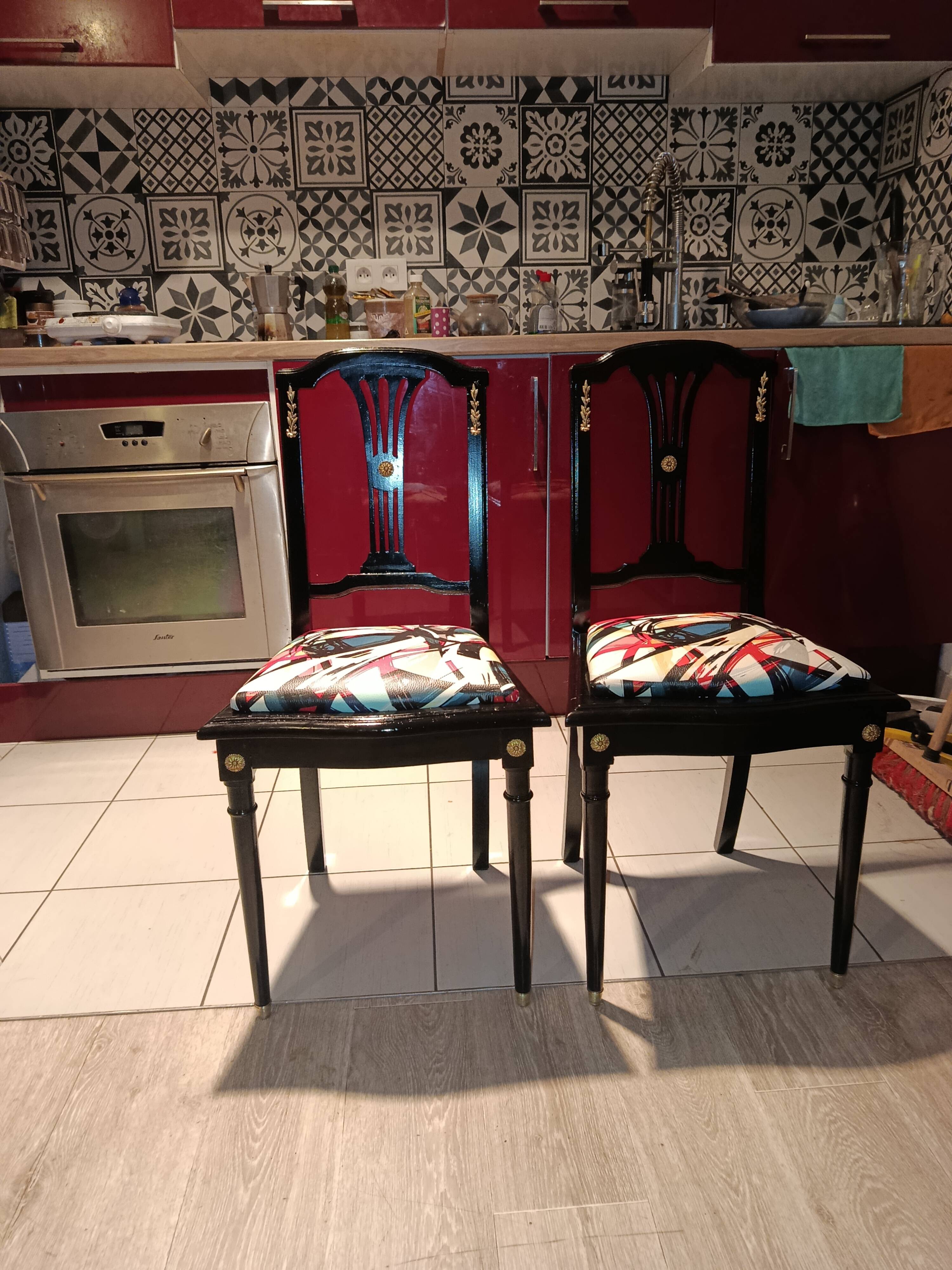 Pair of Hepplewhite neoclassical style chairs, relooked in black lacquer and faux leather.