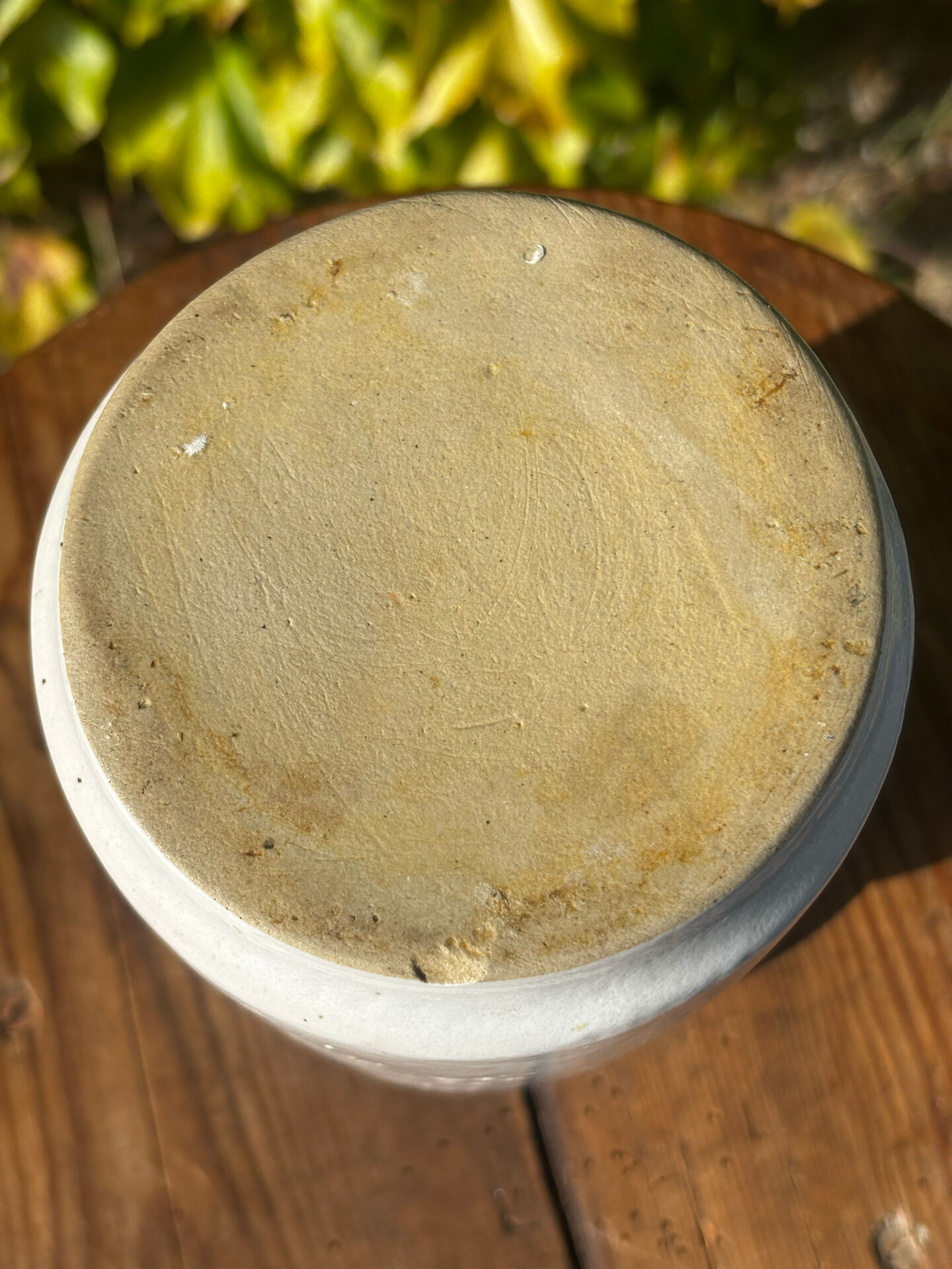 Pretty pot or vase in glazed stoneware with blue drip effect.