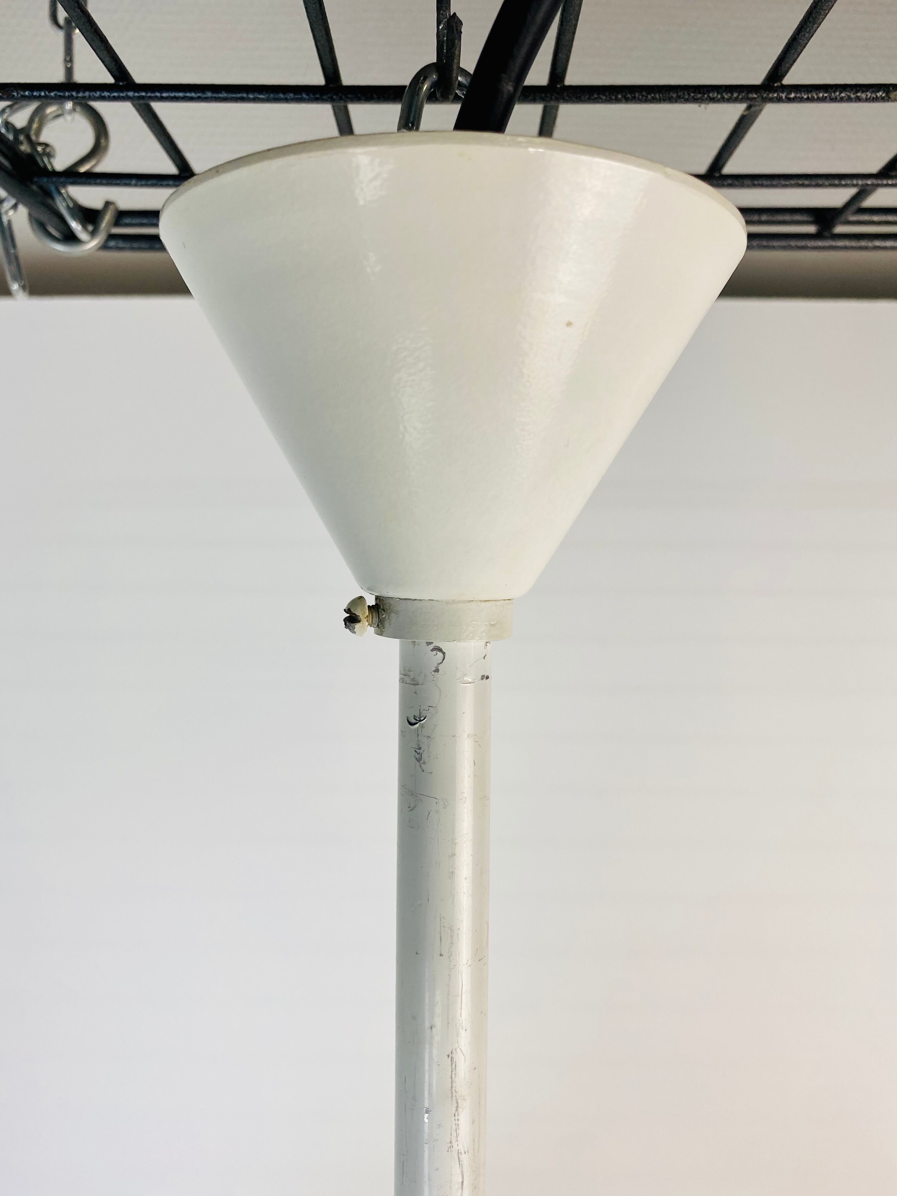 Perforated metal suspension holophanous glass