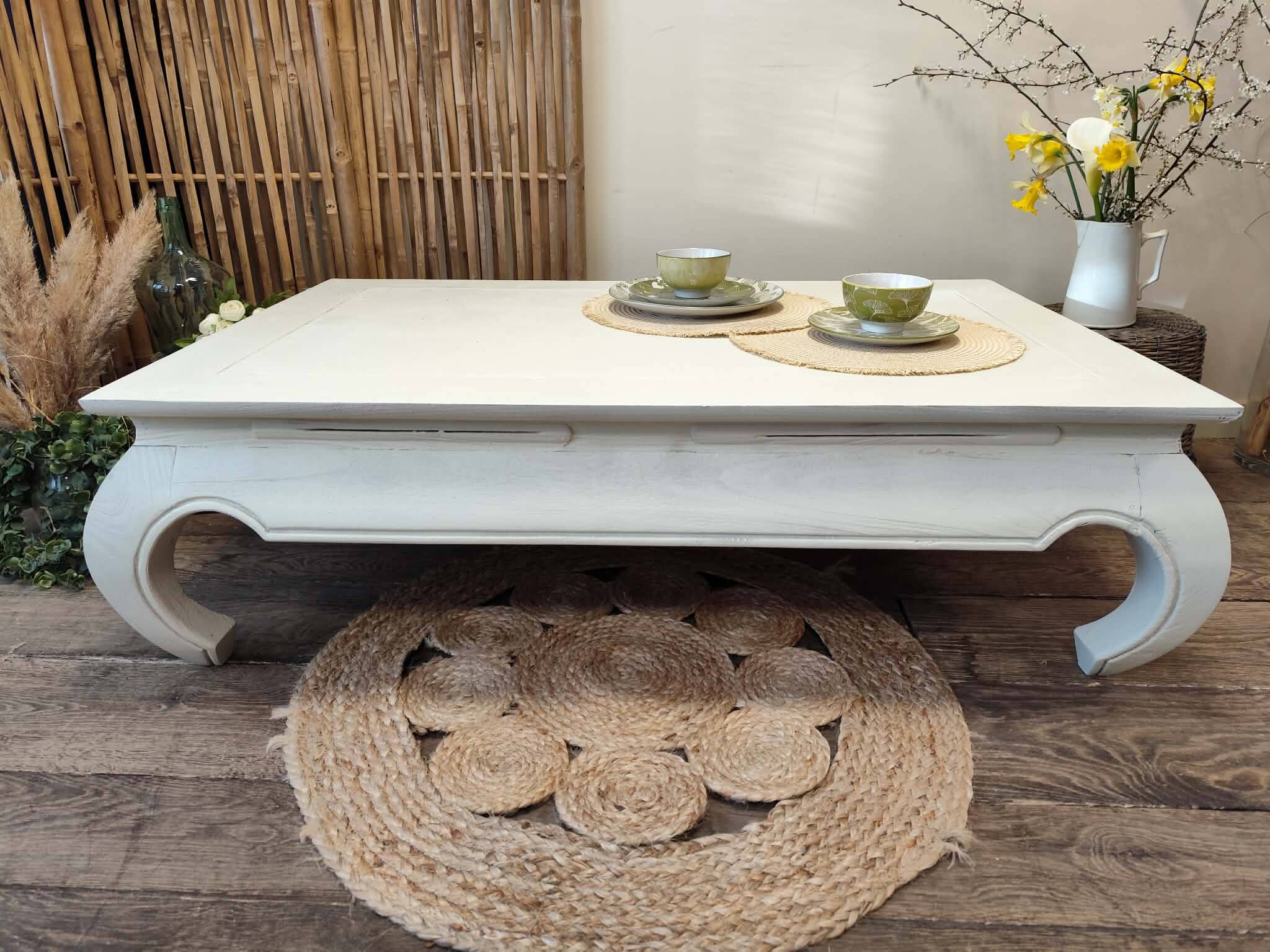 Exotic wood coffee table with its safety glass protection.
