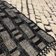 Large cream and black checked Berber rug, 280 × 200 cm.