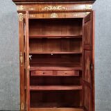 Louis Philippe period wardrobe (nineteenth) entirely covered with gilded bronzes